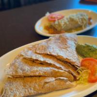 Soy Chorizo Quesadilla (Vegan) · Soy chorizo seasoned with our house spices, pico de gallo, melted cheese in a whole wheat to...