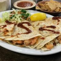 Shrimp Quesadilla · Grilled butterflied shrimp seasoned with our house spices, pico de gallo, and melted cheese ...