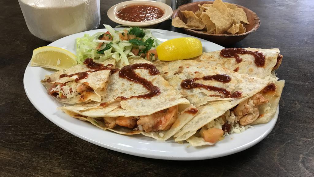 Shrimp Quesadilla · Grilled butterflied shrimp seasoned with our house spices, pico de gallo, and melted cheese in a flour tortilla.