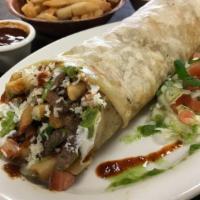 California Burrito · Marinated grilled carne asada seasoned with our house spices, french fries, guacamole, pico ...