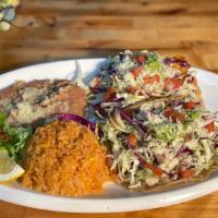 Fish Tacos Combo Plate (Fried, Grilled, Or Vegan) · Two fish tacos grilled or fried seasoned with our house spices topped with white sauce, cabb...