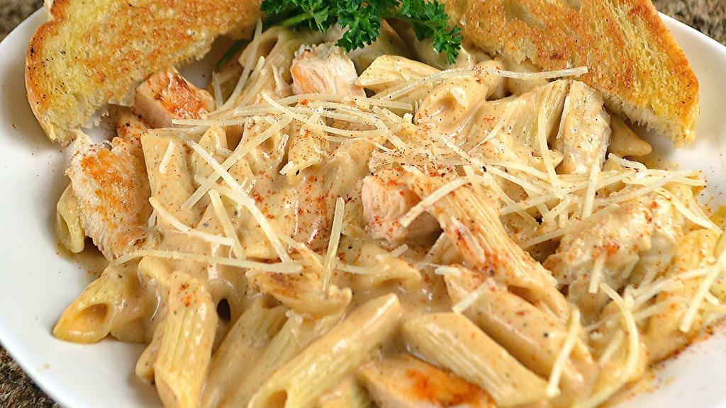 Cajun Chicken Penne · Strips of grilled Cajun seasoned chicken breast mixed into a mound of penne noodles and Cajun cream sauce. Served with garlic toast.