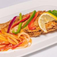Red Snapper · Whole red snapper with bell peppers and onions. Served either steamed or fried.