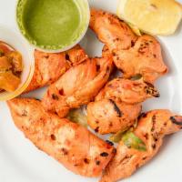 Chicken Tikka · Boneless strips of chicken breast marinated in yogurt, herbs and spices. Roasted in special ...