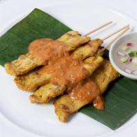 Chicken Satay · A Thai Classic. Thai Marinaded Chicken on a stick, served with Peanut and Cucumber dipping s...