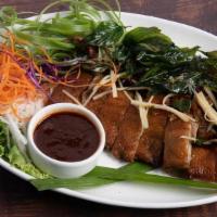 Crispy Duck · Herb Marinated Duck served with Jasmine Rice & House Made Dipping Sauce. Topped with Crispy ...