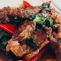 Thai Sweet Basil Duck · Succulent chunks of marinated duck stir fried with crispy basil on top. Served with Jasmine ...