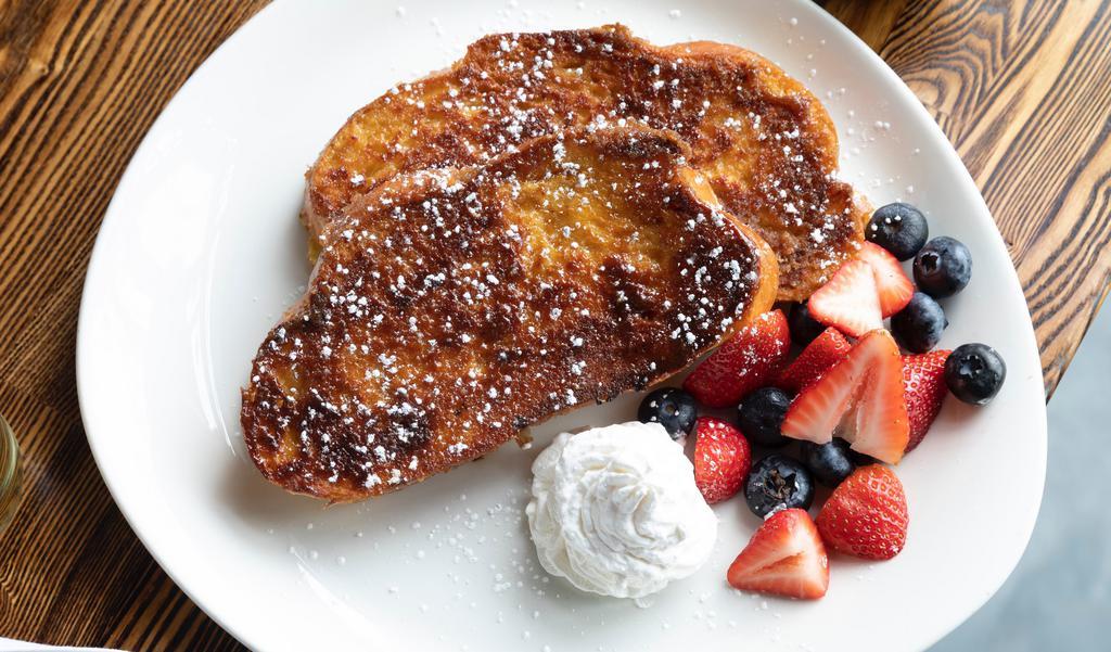 Challah French Toast · thick cut challah, fresh berries, whipped cream, powdered sugar, michigan maple syrup