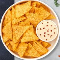 Queen Queso & Chips · Homemade melted cheese dip with warm tortilla chips.