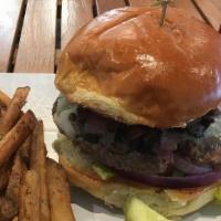 Swiss Burger · Half pound angus beef cooked to order, sautéed red onions, mushrooms, melted swiss, lettuce,...