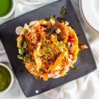 Basket Chaat · Waffle cone bowl filled with papadi, dahi bhalla, chickpeas, potato garnished with yogurt an...