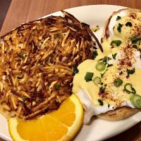 Eggs Benedict · Ham and poached eggs served on an English muffin and topped with hollandaise sauce.