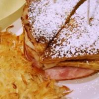 Monte Cristo Sandwich · Double decker pan-fried sandwich with turkey, ham, cheddar, and swiss cheese. Topped with po...