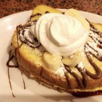 Stuffed French Toast · Bavarian cream, raspberry marmalade, and strawberries sandwiched between two pieces of frenc...