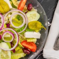 Greek Salad · Two kinds of lettuce, tomatoes, cucumbers, feta cheese, olives, onions, pepperoncini, and an...