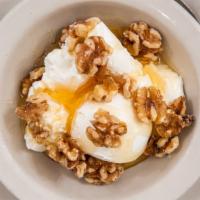Yogurt, Honey & Nuts · Homemade strained yogurt topped with honey and nuts.