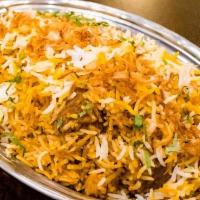 Chicken Tikka Biryani · Long grain basmati rice cooked with a blend of herbs and spices.