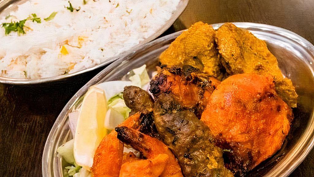 Tandoori Platter · An assortment of our finest from the tandoor. Tandoori shrimp, lamb kabob, chicken tikka and lamb sheekh kabob.