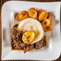 Designer Rice Meal  · Spicy stew fried in palm oil and served with assorted meat, boiled egg, white rice, and plan...