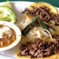 Mini Tacos · 4 mini tacos with side of onions, cilantro, avocado and charro beans