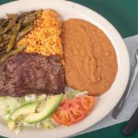 Carne Asada Plate · A big tender skirt steak topped with nopalitos served with rice, beans, salad and tortillas