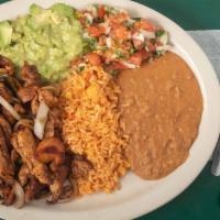 Chicken Fajitas Plate · Chicken fajitas grilled with bell pepper and onion served with rice, beans, pico de gallo, g...