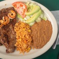 Steak & Shrimp Plate · T-Bone steak and grilled shrimp served with rice, beans, salad and tortillas