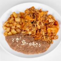 Migas · Served with beans and potato breakfast. Chorizo, onions, cilantro, tomato, and tortilla chips.
