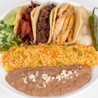 Mi Special · Three tacos corn or flour tortillas choice of meat served with rice and beans.