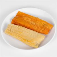 Tamales · Corn masa filled with pork meat cooked in red or green salsa.
