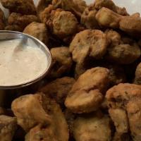 Fried Mushrooms · Sliced mushrooms hand battered and deep fried. Served with house made buttermilk ranch.