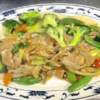 Pork W/ Mixed Vegetables · Slices pork stir fried with broccoli, carrots, bell-peppers, onions, snow peas, napa, and mu...