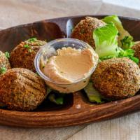 Falafel (6) · 6 pieces of falafel. Add your choice of protein chicken shawarma or gyro meat or beef for an...