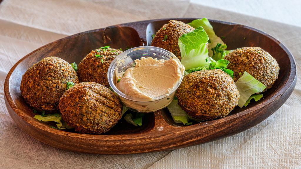 Falafel (6) · 6 pieces of falafel. Add your choice of protein chicken shawarma or gyro meat or beef for an additional charge.