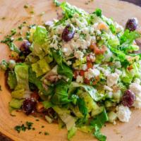 House Salad · Fresh cut romaine lettuce, tomatoes, onions, cucumber, parsley, feta cheese and kalamata oli...