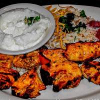 Shish Tawook · Boneless, skinless chicken breast cubes, marinated in our special sauce and charbroiled.