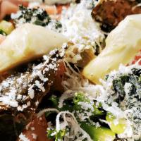 Mediterranean Salad · House salad topped with olives, grape leaves, artichokes, spinach and feta.