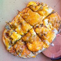 Breakfast Pizza · Eggs, sausage, bacon, mixy cheese on a saucy gravy pizza crust enough for 2.