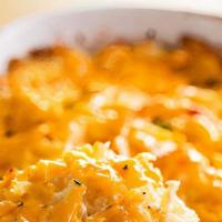 Hashbrown Casserole · Shred potato, butter, cheese, cream, wee spicy pimento & Pink’s spices baked with love & a f...