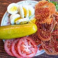 Protein Plate · 5 pieces bacon, 2 hard boiled eggs, sliced tomato, pickles, deli cheese.