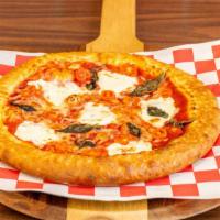 Margherita Pizza · fresh mozzarella cheese, tomato, fresh basil over our sweet & tangy pizza sauce