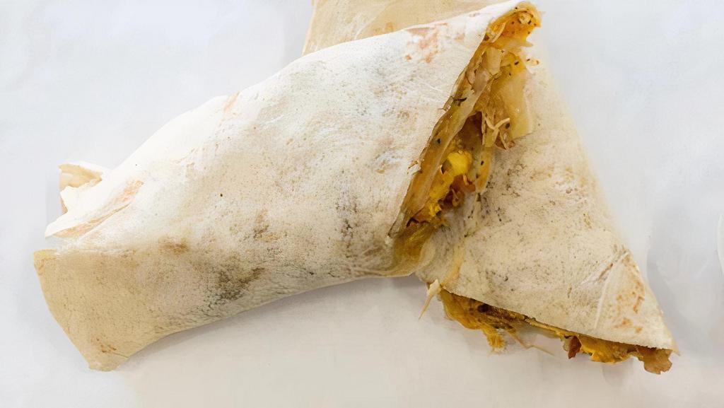 Breakfast Burrito · Flour tortilla brushed with butter then filled with sausage, shredded cheddar, southwest egg, and our special seasoning.