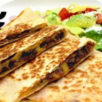 Quesadilla · Popular item. A flour  tortilla filled with your choice of meat and cheese. Served with  a s...