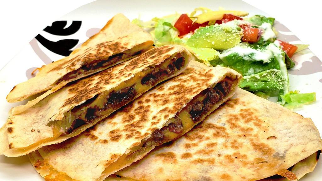 Quesadilla · Popular item. A flour  tortilla filled with your choice of meat and cheese. Served with  a salad on  the side. Also, we have a vegetarian choice. Filled with just cheese and salad on the side.