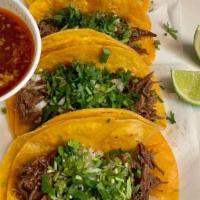Birria (Order Of Four Regular )  · order of four birria style ( beef soft tacos) topped with onions and cilantro .consome on th...