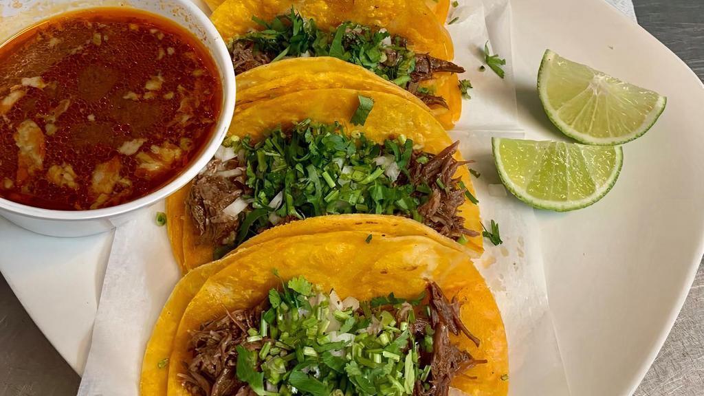 Birria (Order Of Four Regular )  · order of four birria style ( beef soft tacos) topped with onions and cilantro .consome on the side
