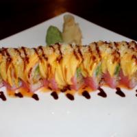 Mango Crunch Roll · Shrimp Tempura, crab stick, avocado in soy paper wrapped roll. Mango on top with Tempura cru...