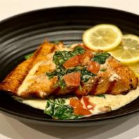 Salmon Florentine · A golden grilled Salmon fillet accompanied in a bed of creamy spinach sauce, topped with fre...