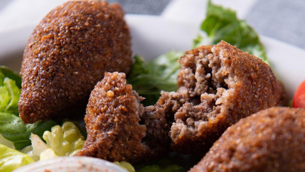 Kibbeh · Deep fried bulgur balls with ground beef, onions, pine nuts, and our special spices. Served with tzatziki.