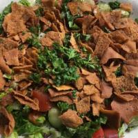 Fatoush Salad · A unique salad made with lettuce, tomatoes, cucumbers, onions, parsley, and fried pita bread...
